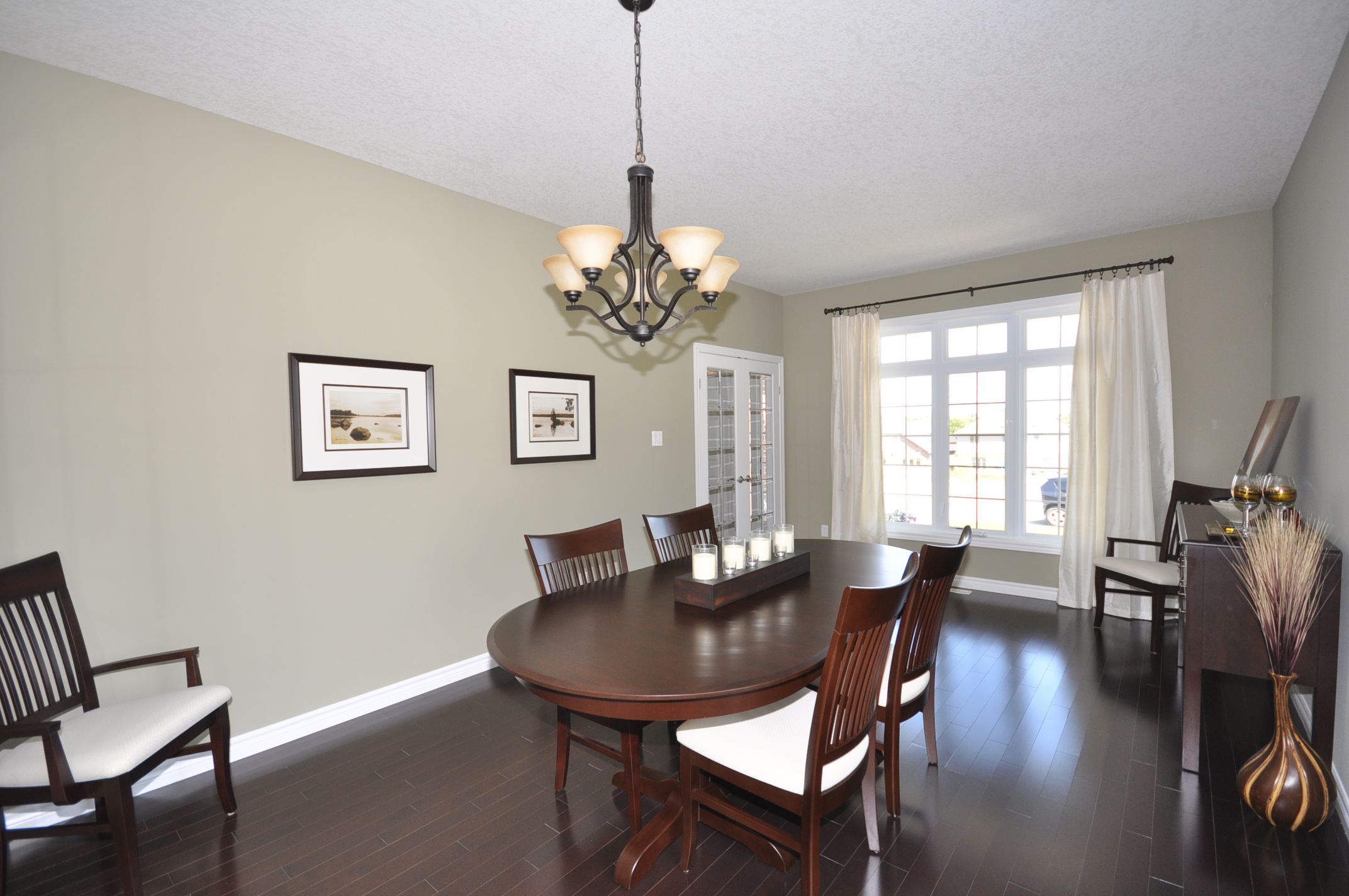 Living/Dining room combo with gleaming hardwood floors