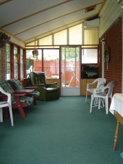 Relax with your morning coffee in this large 3 season sunroom 