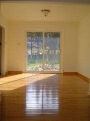 Dining room also has new hardwood flooring, trim plus updated sliding doors to large backyard 