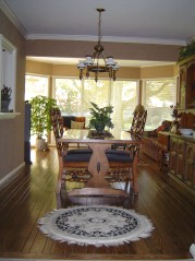 Formal dining area with newer plank flooring and lovely crown moldings 