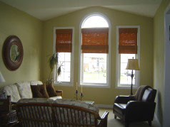Spacious living room with large palladium window