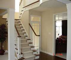 Open side staircase to second level off foyer