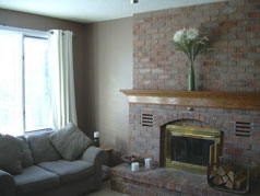 Main floor family room with wood burning fireplace