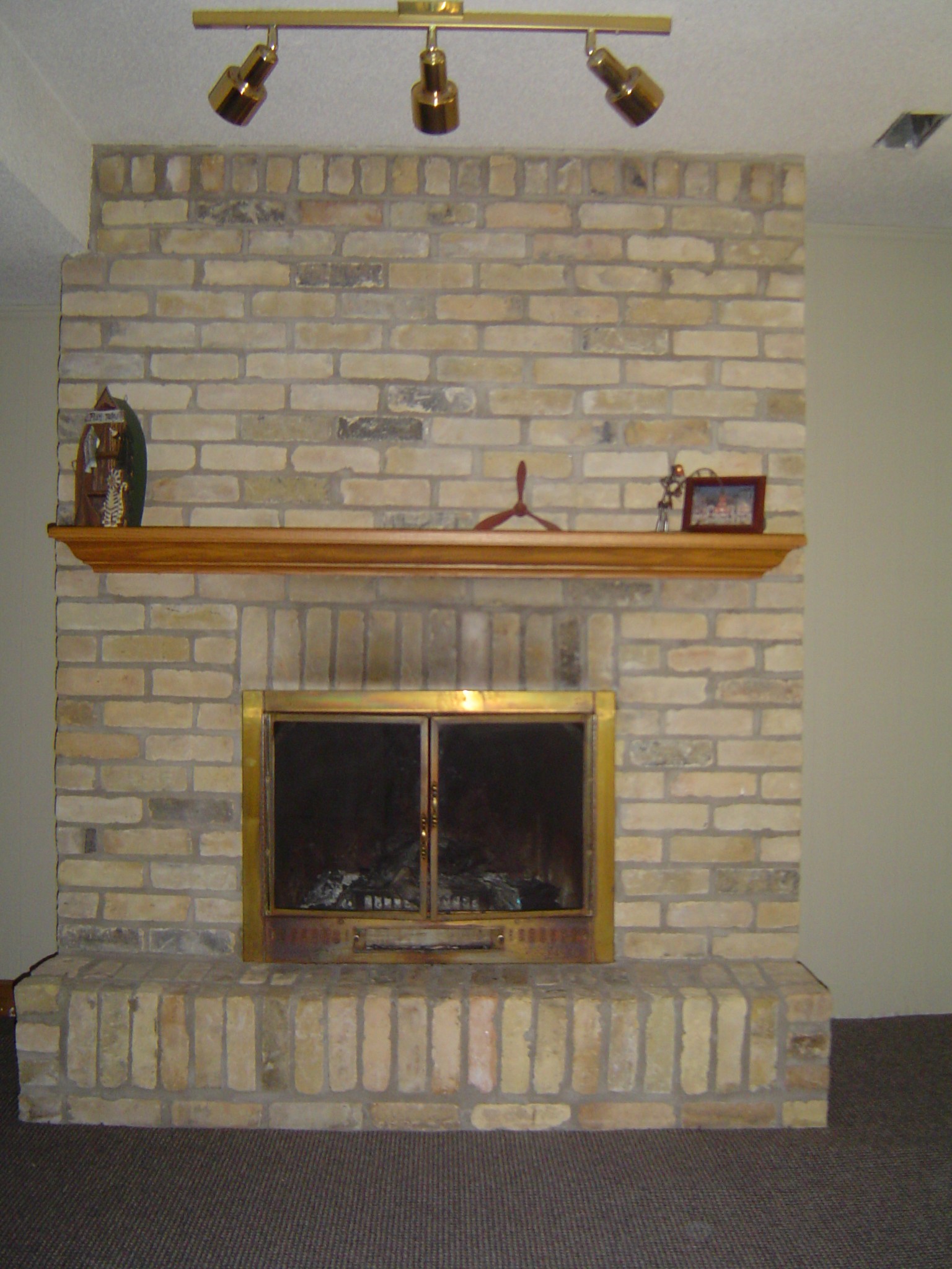 Floor to ceiling reclaimed yellow brick fireplace